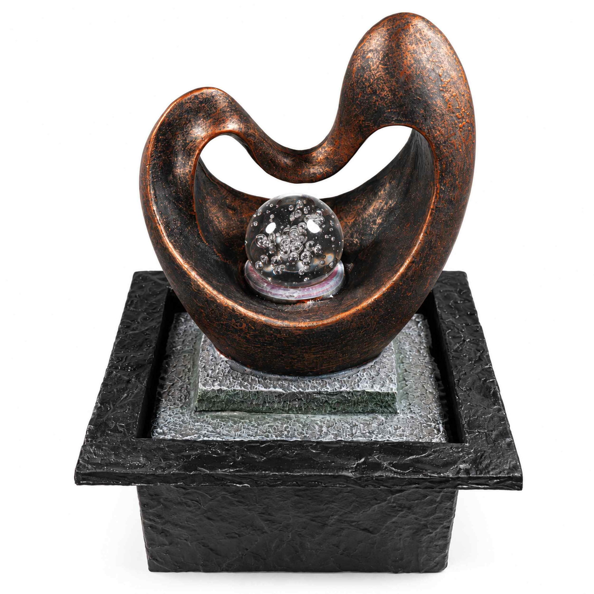 Zimmerbrunnen Herzform mit rotierender Glaskugel und LED Zimmerbrunnen in Herzform aus dunklem, strukturiertem Material mit rotierender Glaskugel und LED-beleuchtetem Wasserspiel auf eckigem Sockel